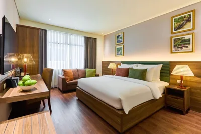 Deluxe Double con ventana, té de la tarde gratis — KiN Hotel Thi Sach Edition